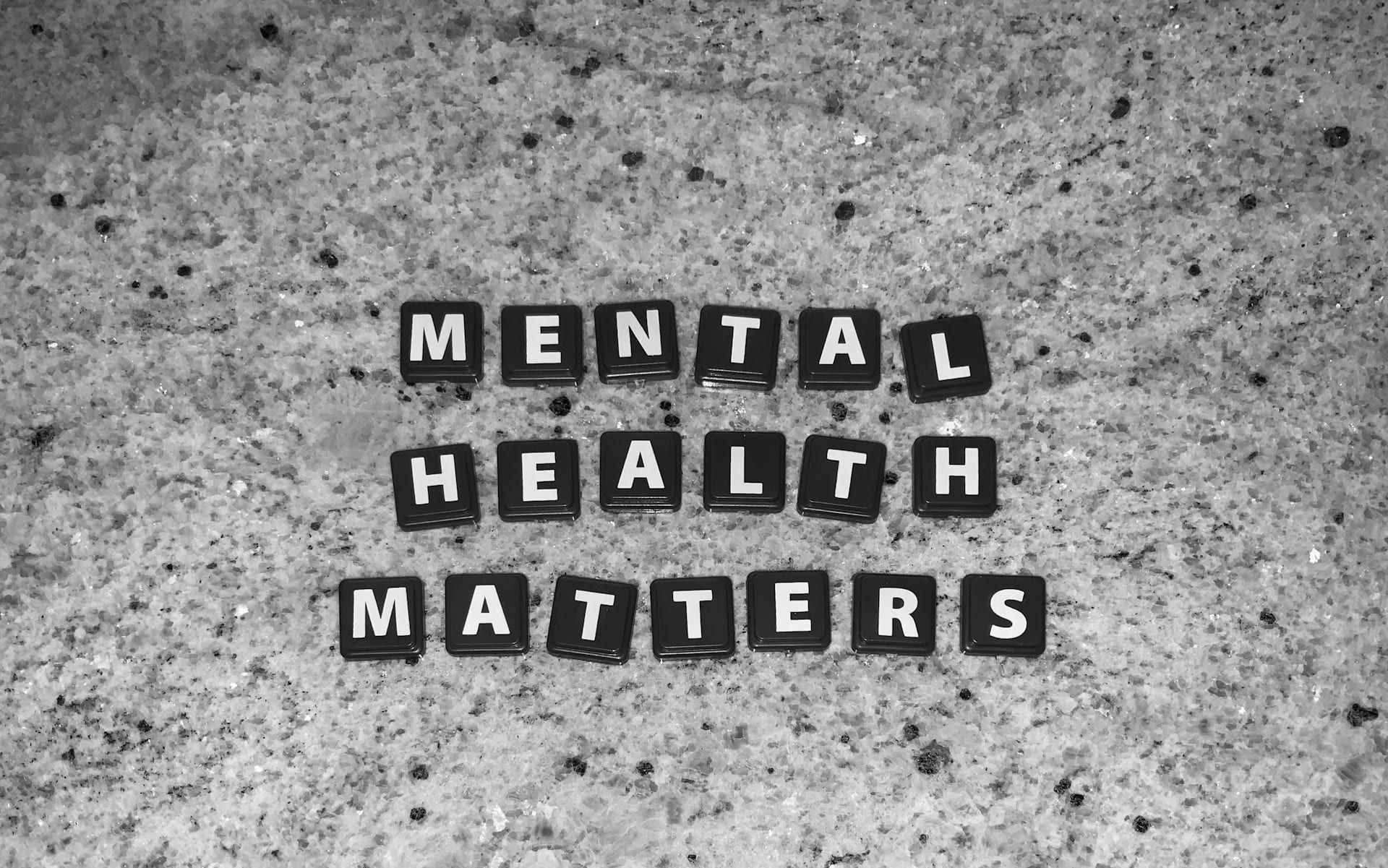 Mental Health Matters spelled out in tile letters on a stone surface