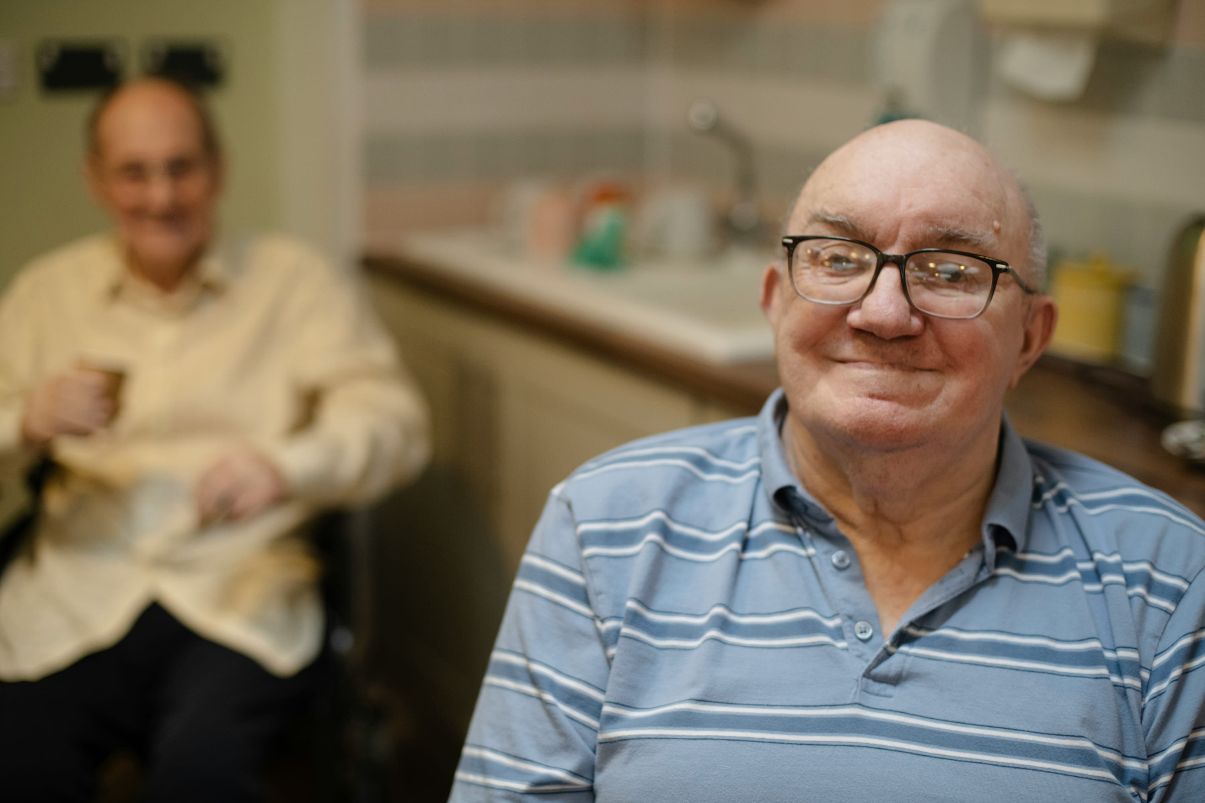 A contented older man at home in the Treasure Valley, Idaho — the kind of independence and dignity companion care from Abundance Living helps preserve